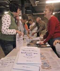 Stuffing envelopes for the Catholics Come Home campaign in the basement of Saint Anne Church in Bismarck on 11-18 morning are volunteers Kathy Schumacher, left, and Berneice Famias, right. In back are Karen Gainsforth, left, Georgia Keller, center, and Roy Nagel. Deacon Tony Finneman said the group would be filling 5000 envelopes. "These will go to all of the parishes in the Diocese of Bismarck," said Finneman "and they are intended for people who want to learn more about the Catholic faith and those who have been absent from the faith."