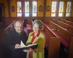 The. Rev. Paul Soper of the Church of St. Albert the Great in Weymouth and Betsy Clifford, pastoral associate and music director, consider hymn selections for the open house that will be held on March 9, 2011.